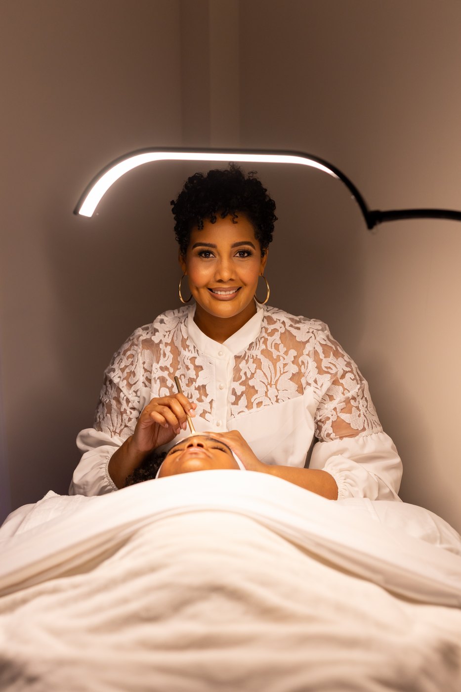 Tamara Jones, founder and licensed esthetician, giving a facial